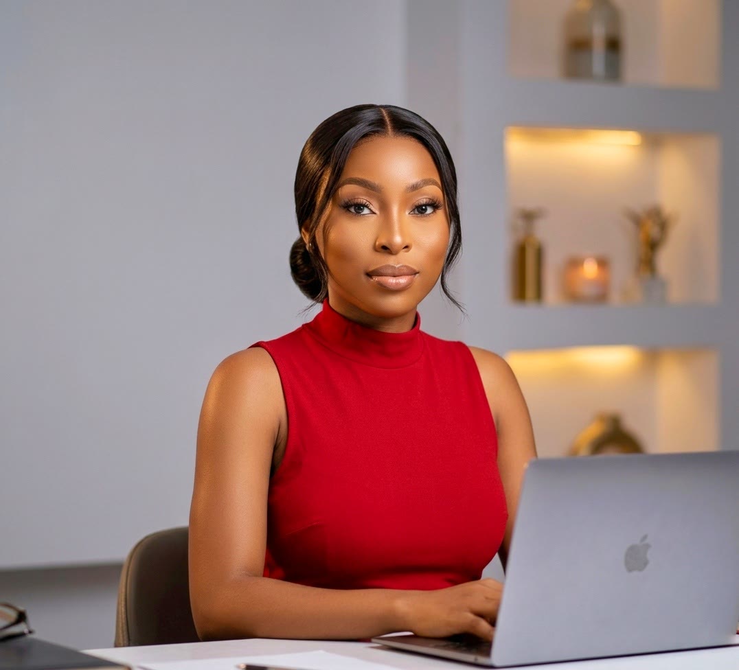 Prisca at her laptop